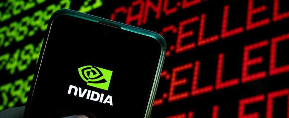 Nvidia logo on phone in front stock ticker.
