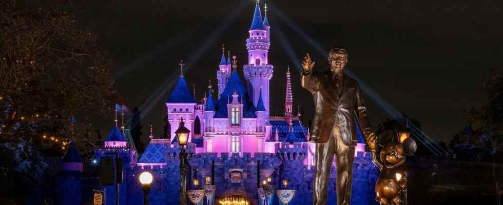 Partners statue and Sleeping Beauty Castle at night