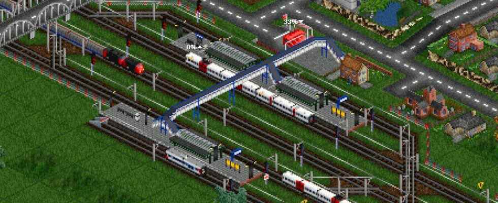 An image from transport game OpenTTD of trains and a village