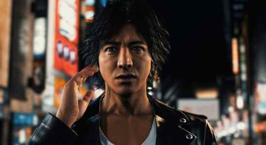 Judgment - Yagami stands on a city street, looking above