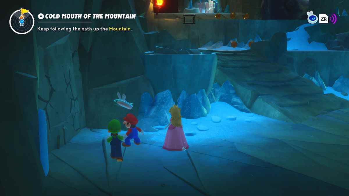 Mario, Luigi et Peach se tiennent devant un mur fissuré dans une grotte de glace dans Mario + Rabbids Sparks of Hope