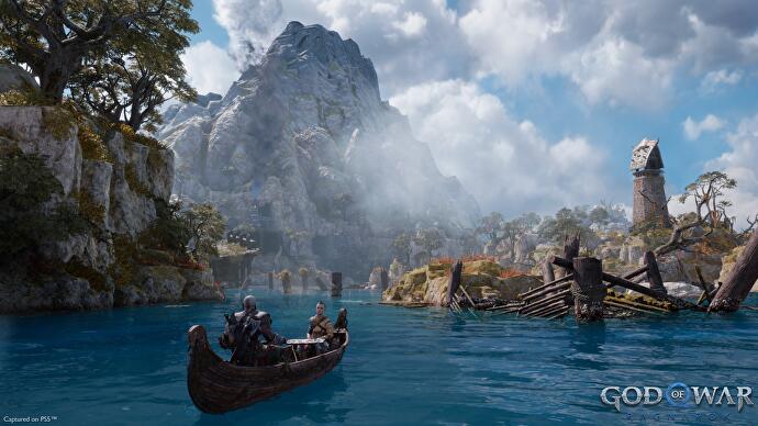 Aperçu de God of War - Kratos et un garçon pagaient dans des eaux torrides avec une montagne en arrière-plan
