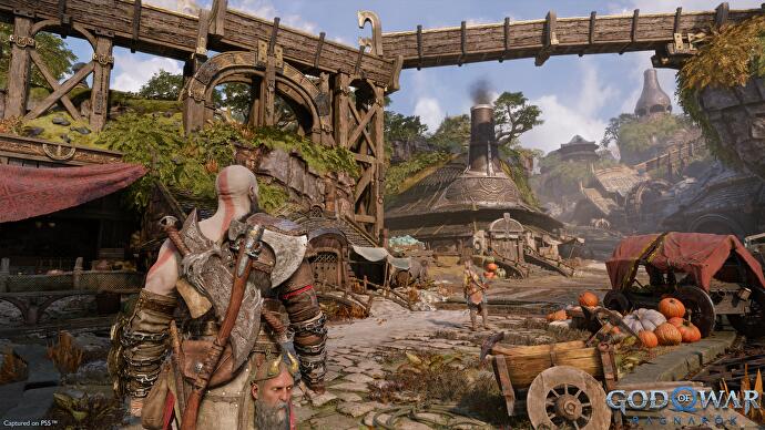 Aperçu de God of War - Kratos entre dans une sorte de ville rurale du royaume nain.