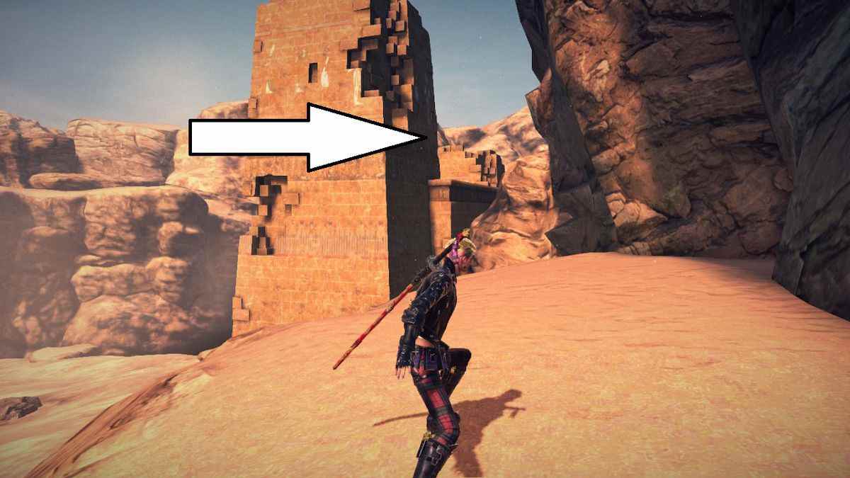Viola se tient devant une tour au milieu d'un désert à Bayonetta 3.