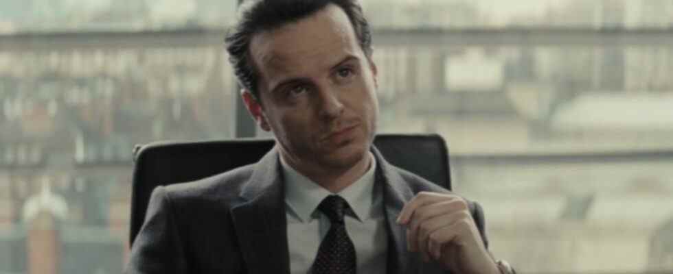 Andrew Scott sits at his desk with authority in Spectre.