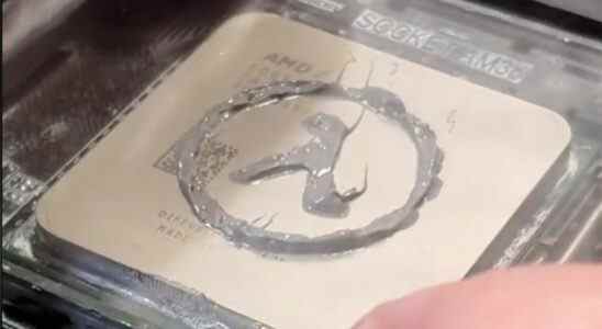 The Half-Life logo drawn in thermal paste on a CPU
