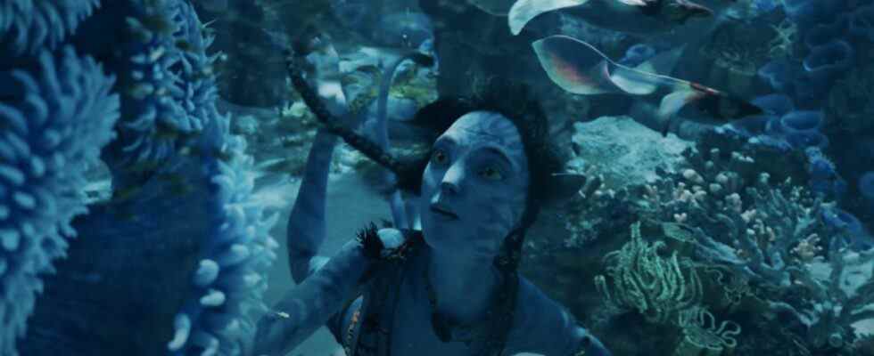 Kiri stares at impressive underwater plant life in Avatar: The Way of Water.