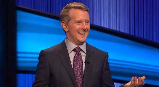 Ken Jennings smiling and hosting Jeopardy
