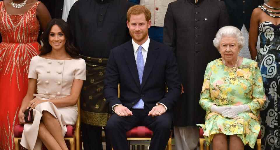Meghan Markle est assise avec le prince Harry et la reine lors d'un événement en 2018. (Getty Images)