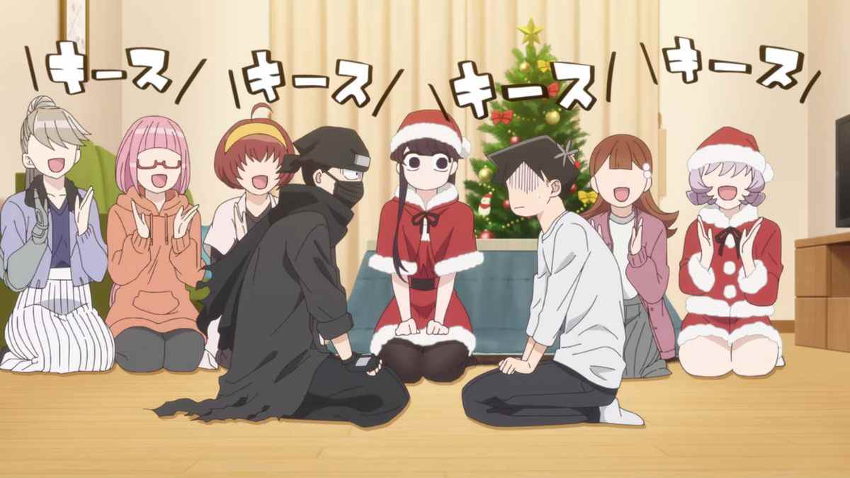 Un groupe de filles d'anime, certaines d'entre elles en tenue de père Noël, s'assoient en rang tout en applaudissant et en chantant devant deux garçons d'anime embarrassés.