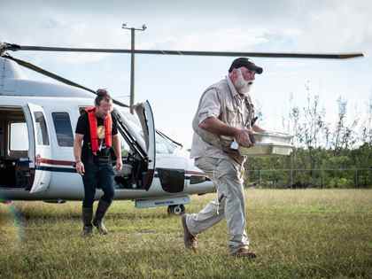 José Andrés (R), carrying a tray of food, and Sam Bloch (L), WCK's Director of Emergency Response. (Credit: National Geographic/Sebastian Lindstrom)