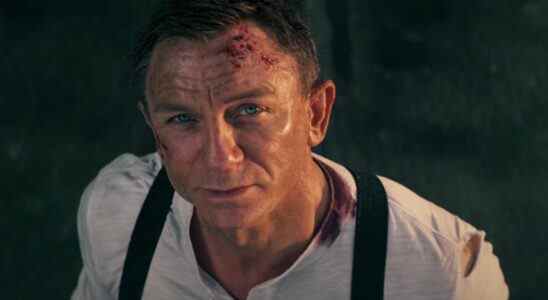 Daniel Craig looks up bittersweetly in No Time To Die.