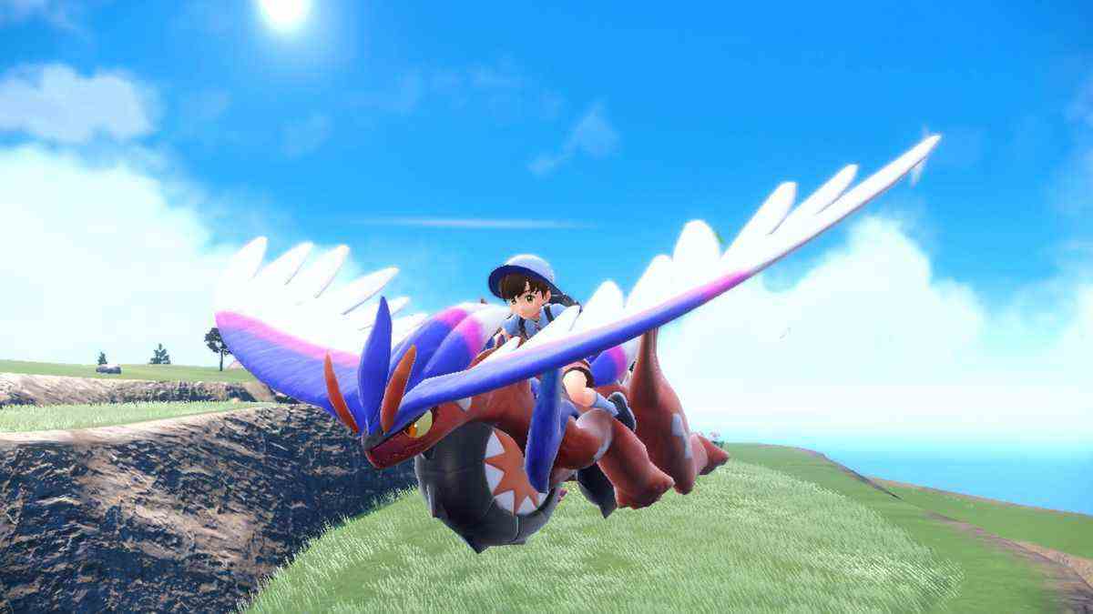 Une image d'un dresseur de Pokémon glissant sur un Koraidon dans Pokémon Scarlet.
