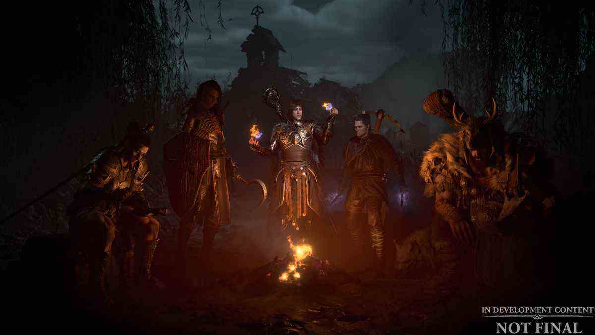 Un barbare, un nécromancien, un sorcier, un voleur et un druide se rassemblent autour d'un petit feu de camp dans l'écran de sélection de classe de Diablo 4.
