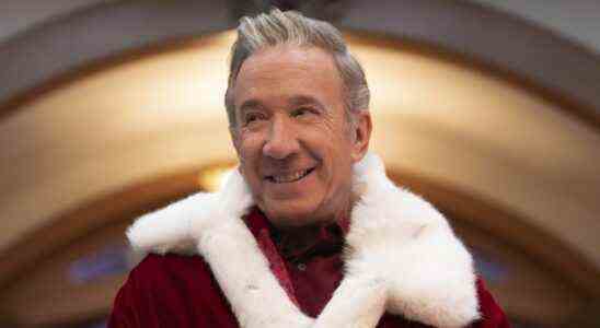 Scott smiling in Santa coat in The Santa Clauses