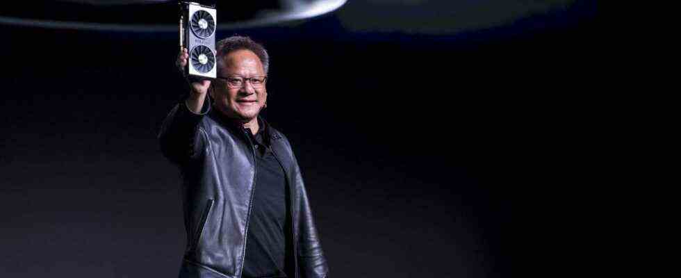 Jen-Hsun Huang, president and chief executive officer of Nvidia Corp., holds up the new Nvidia GeForce RTX 2060 graphics processor during the company