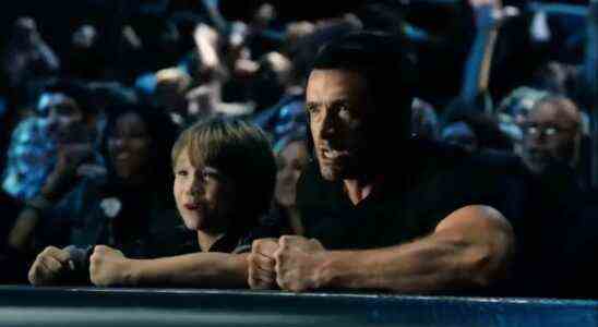 Dakota Goyo and Hugh Jackman cheering on the side of the ring in Real Steel.