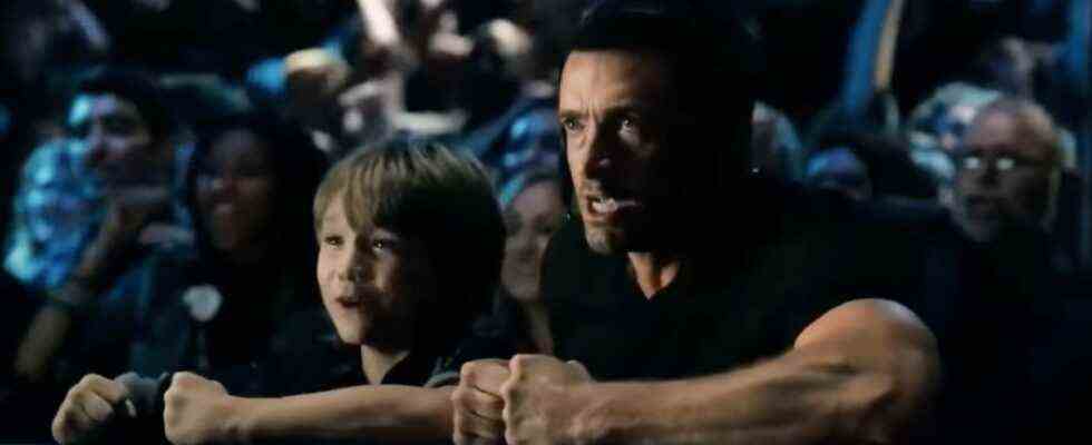 Dakota Goyo and Hugh Jackman cheering on the side of the ring in Real Steel.
