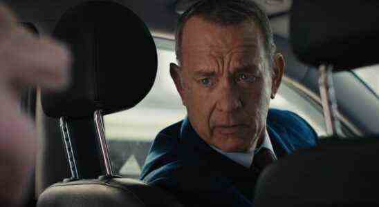 Tom Hanks looks back from the driver