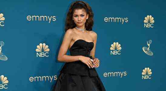 Zendaya poses in an elegant black dress on the red carpet at the 2022 Emmys.