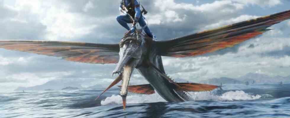 Jake rides a winged creature over the ocean in Avatar: The Way of Water.
