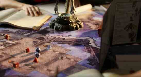 One D&D image of a battlemap, dice, and books