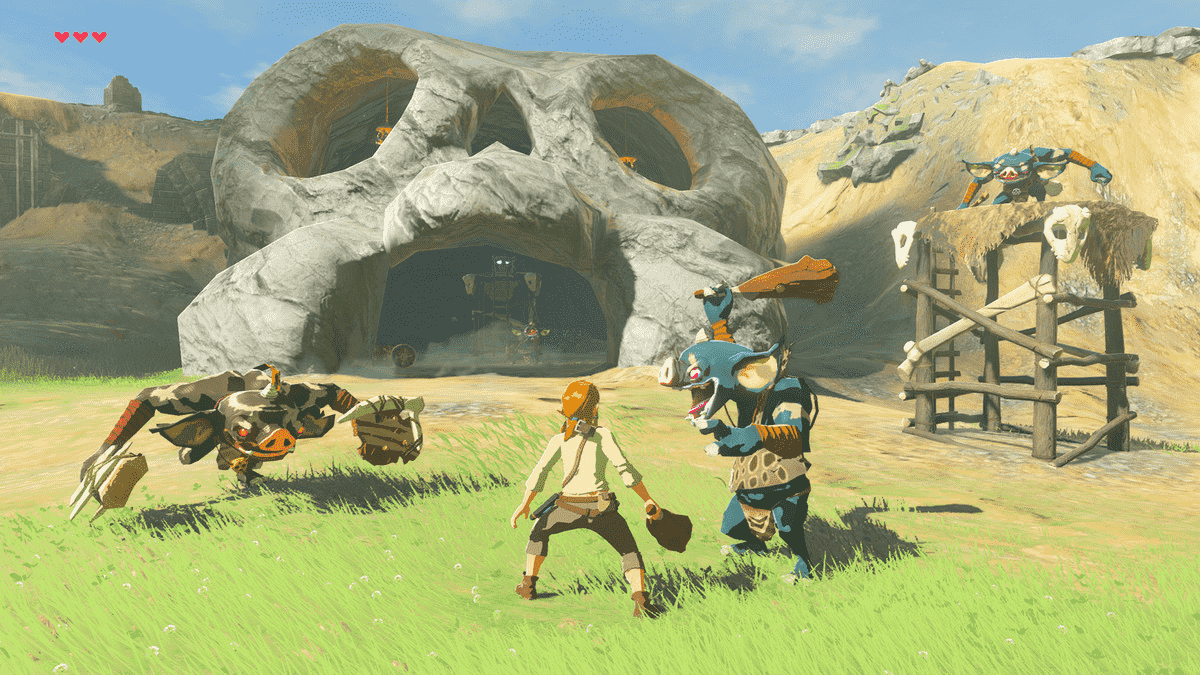 Link combattant des bokoblins devant une grotte en forme de crâne dans Breath of the Wild