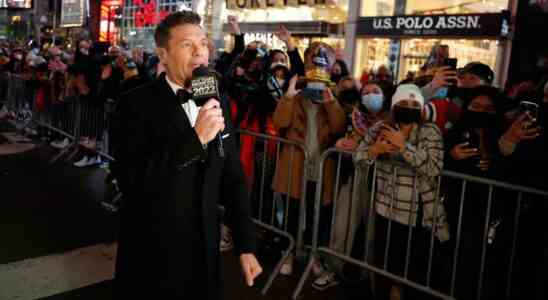 NEW YORK, NEW YORK - DECEMBER 31: Ryan Seacrest speaks  during the 2021 New Year’s Eve celebrations in Times Square on December 31, 2021 in New York City. Despite a major surge in Covid -19 cases in New York City and across the country, the city held a scaled-down celebration for the annual ball drop. This year, a maximum of 15,000 people will be in attendance, down from approximately 60,000, and proof of vaccination and protective masks are required. (Photo by John Lamparski/Getty Images)