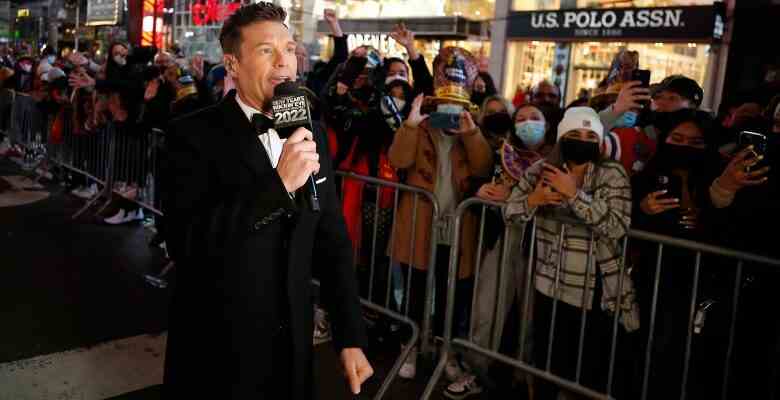 NEW YORK, NEW YORK - DECEMBER 31: Ryan Seacrest speaks  during the 2021 New Year’s Eve celebrations in Times Square on December 31, 2021 in New York City. Despite a major surge in Covid -19 cases in New York City and across the country, the city held a scaled-down celebration for the annual ball drop. This year, a maximum of 15,000 people will be in attendance, down from approximately 60,000, and proof of vaccination and protective masks are required. (Photo by John Lamparski/Getty Images)