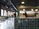 Des travailleurs sont vus autour d'un bar de style café dans les bureaux de Lightspeed à Montréal sur une photo non datée. 