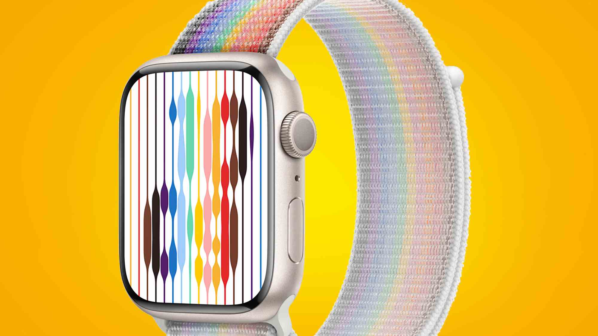 Une Apple Watch avec un bracelet Pride Edition sur fond jaune