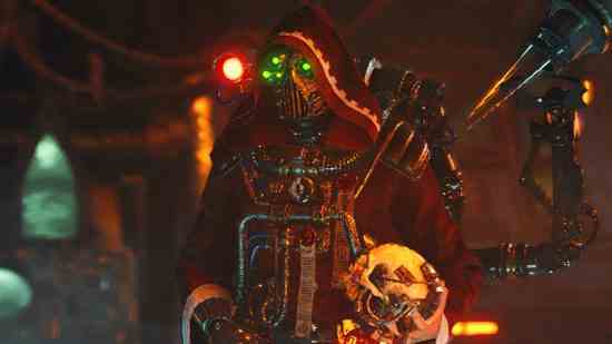 Notes de mise à jour Warhammer 40k Darktide - un vendeur en robe cramoisie avec des lumières vertes sur son masque