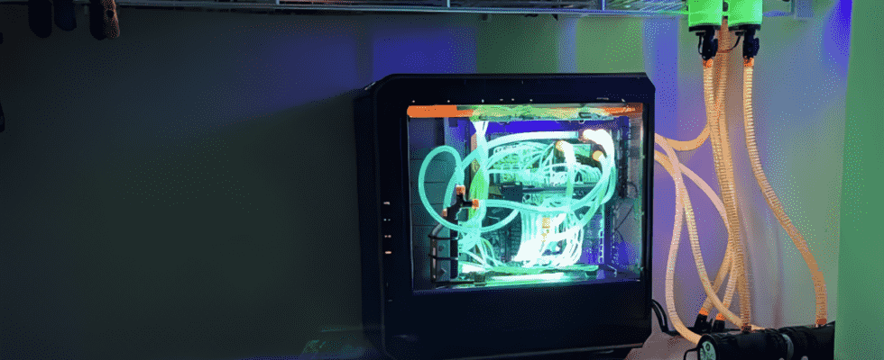 Gaming PC with custom liquid cooling loop with UV reactive liquid and elements