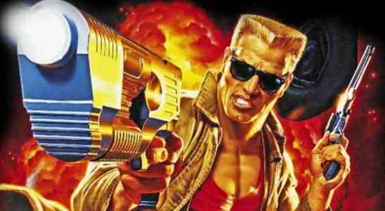 Duke Nukem with arm outstretched, pistol in hand, aiming at the screen
