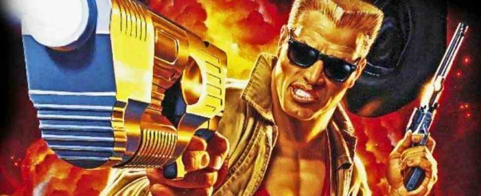 Duke Nukem with arm outstretched, pistol in hand, aiming at the screen