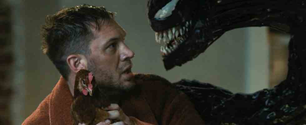 Eddie Brock with a live chicken and Venom in Let There Be Carnage