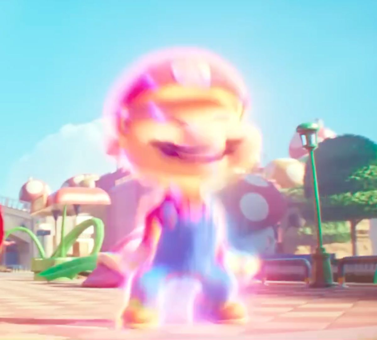 Mario se transforme en sa plus grande forme après avoir mangé un super champignon dans une image du film The Super Mario Bros.