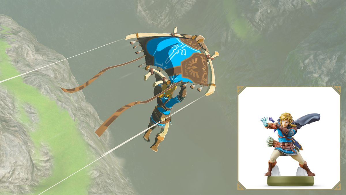 Link glisse sur un gouffre dans Tears of the Kingdom à l'aide d'un planeur à motifs bleu et marron.  L'amiibo Tears of the Kingdom Link est affiché dans le coin inférieur.
