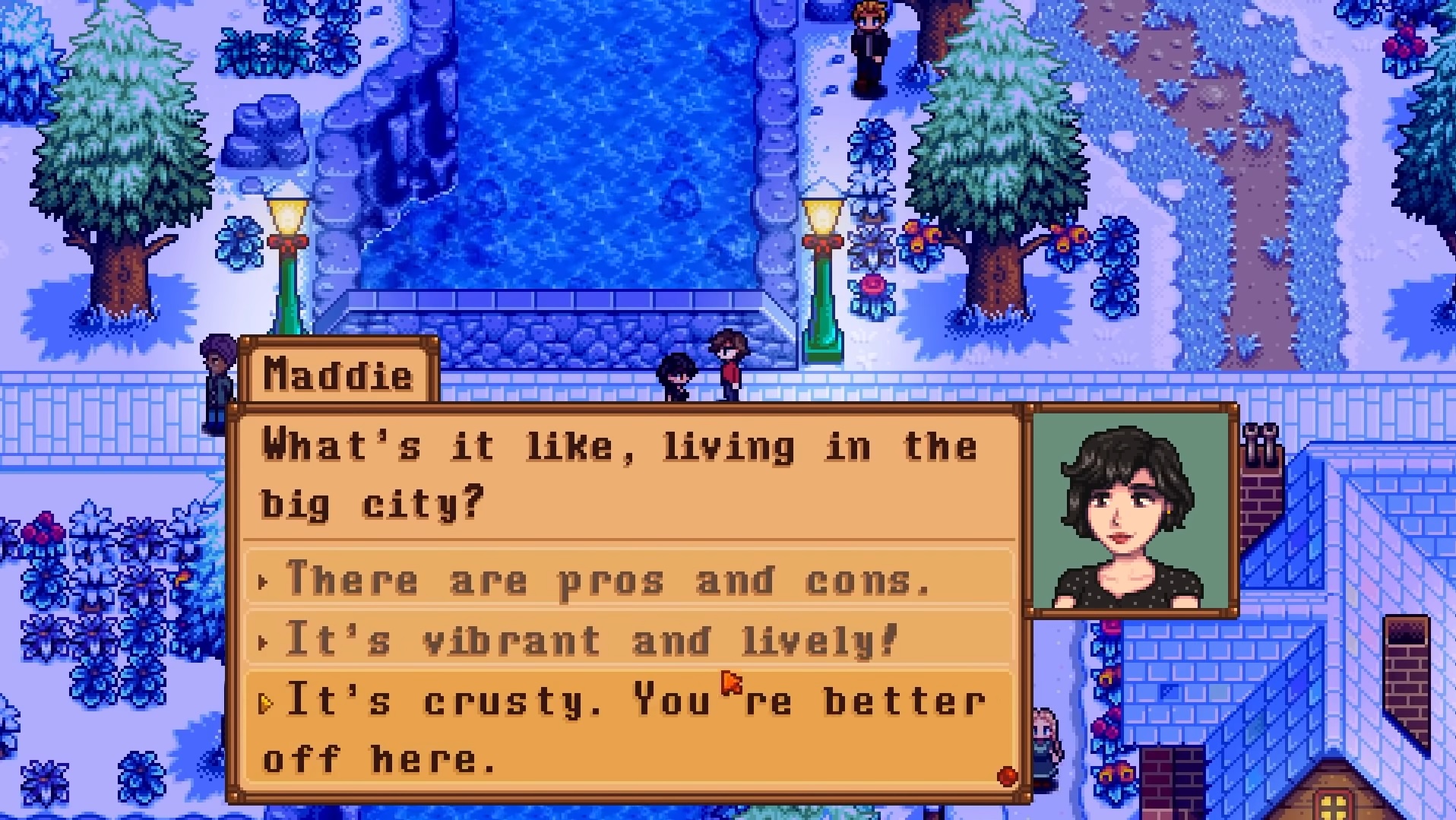 Haunted Chocolater - Maddie demande au joueur ce que c'est que de vivre dans la grande ville alors que les deux se tiennent dehors sur un pont enneigé de la ville.