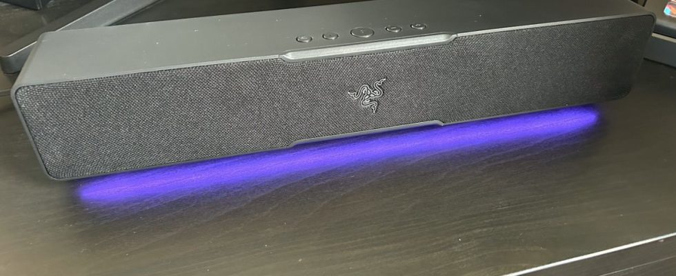 Razer Leviathan V2 X soundbar on a desk with RGB lighting switched on