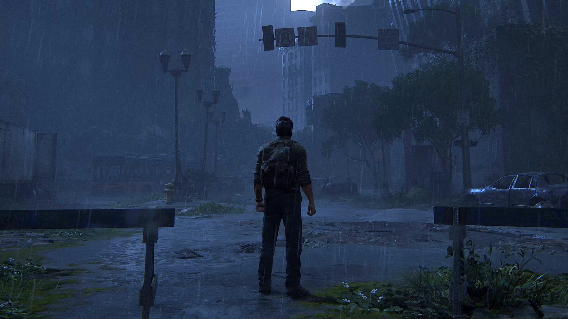 Les meilleurs paramètres de Last of Us: Joel debout dans un paysage urbain pluvieux