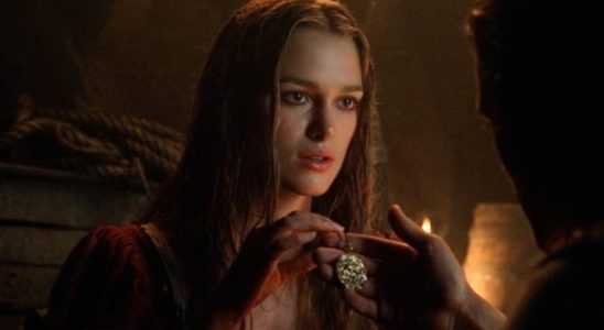 Keira Knightley holding the pendant in Pirates of the Caribbean