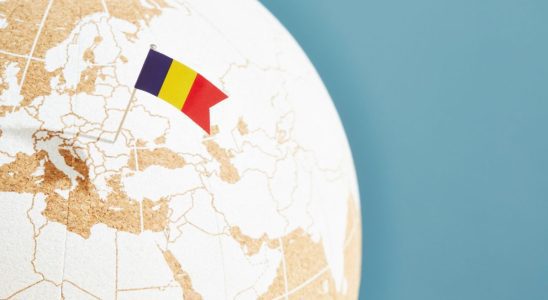 A globe with the Romanian flag popping up on it.