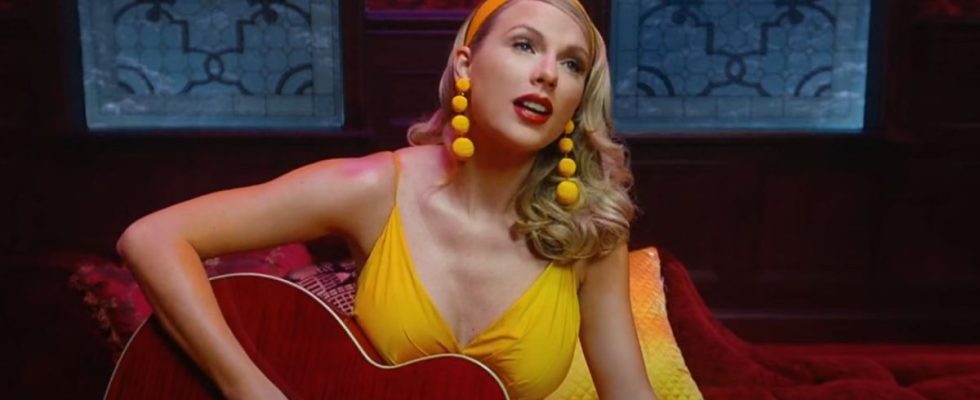 Taylor Swift in a yellow dress in the Lover music video.