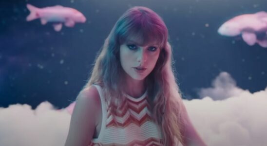 Taylor Swift in the Lavender Haze music video with koi fish in the background.