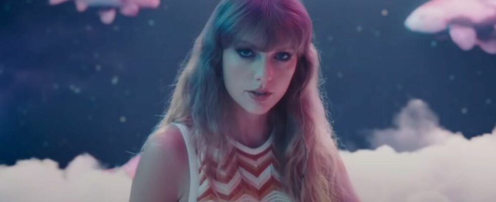 Taylor Swift in the Lavender Haze music video with koi fish in the background.