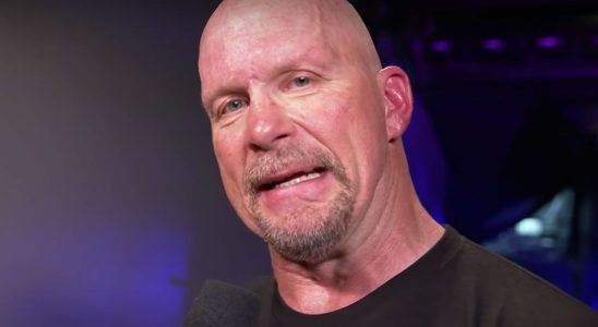 Stone Cold giving an interview after his match at WrestleMania 38.