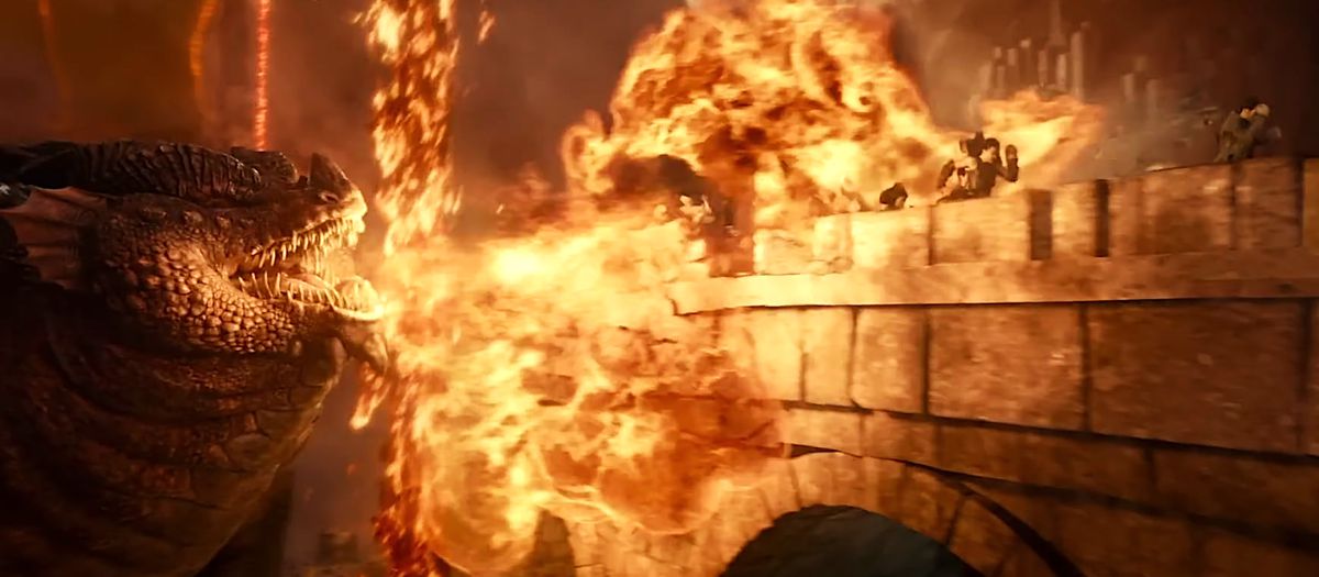 Themberchaud le grand dragon boi soufflant le feu lors d'une fête alors qu'ils traversent un pont dans les donjons &AMP ;  Film de dragons