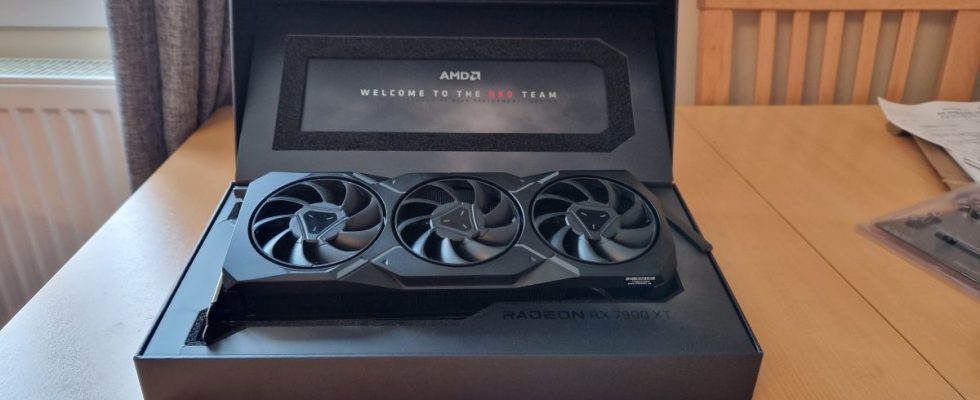 AMD Radeon RX 7900 XT review image showing the GPU in its raised open box position