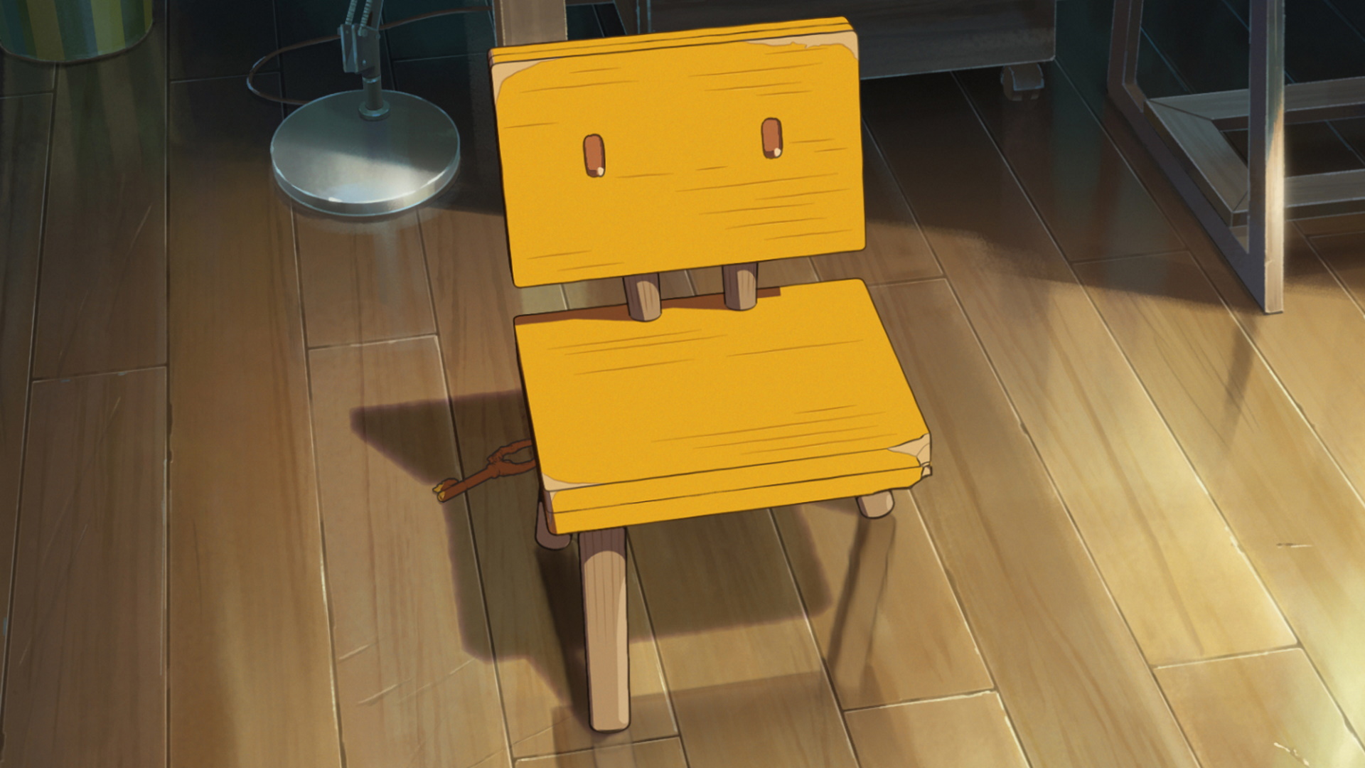 Une chaise se tient seule dans une image de l'anime Suzume